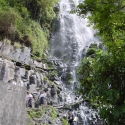 The waterfall of Baños leading to the hot spring pools