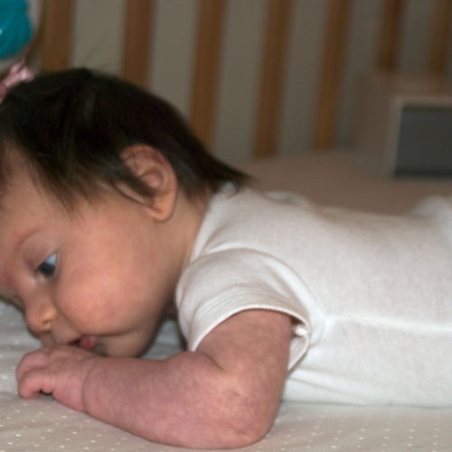 Relaxing in her crib