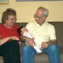 Bubbie, Grandpa and Sara together on the sofa