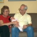 Bubbie, Grandpa and Sara together on the sofa