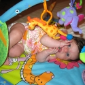 Playing on her playmat