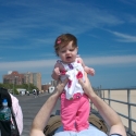 Sara and Daddy playing on the boardwalk in Coney Island