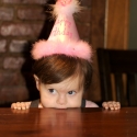 The birthday girl awaits her cake!