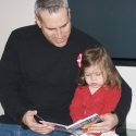 Daddy and Sara reading a new book