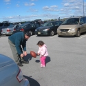 Julia and Warren play football in the Parking Lot
