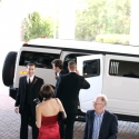 Hastings exits the limo and Kerry smiles for the crowd of on-lookers