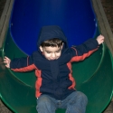 Michael carefully gets off the slide