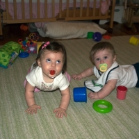 Sara and Grant play on the carpet