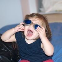 Fitting Daddy's goggles to Peanut's face