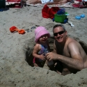 Daddy and Sara dig a giant hole in the beach